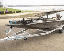 Xpress boat sitting on a BackTrack Trailer